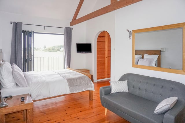 The superb master suite houses a dressing area, en-suite bathroom, master bedroom with vaulted ceilings, and Bi-fold doors offering stunning countryside views.