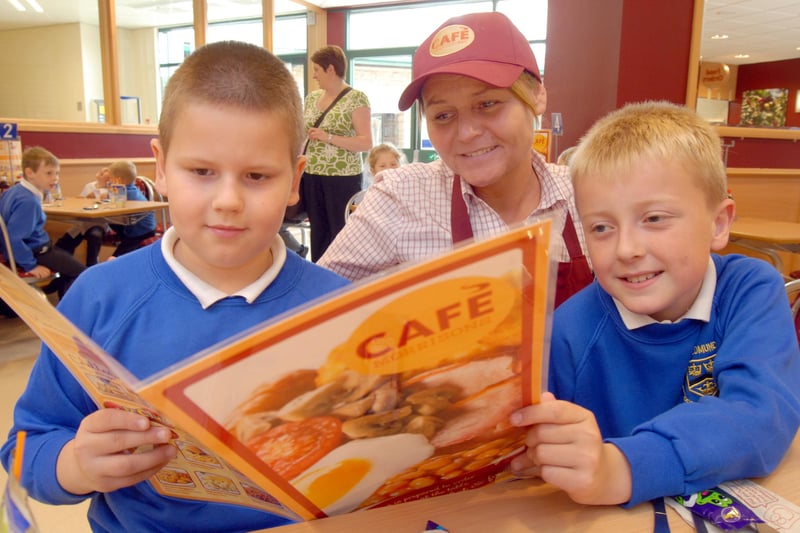 Daniel, left, and Leon, pupils at St Edmund's School at Mansfield Woodhouse, pictured with staff member Terri Lee during their visit to the new Morrisons café in 2009.