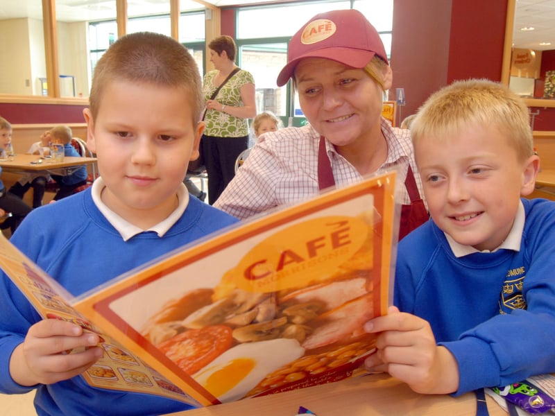 Daniel, left, and Leon, pupils at St Edmund's School at Mansfield Woodhouse, pictured with staff member Terri Lee during their visit to the new Morrisons café in 2009.