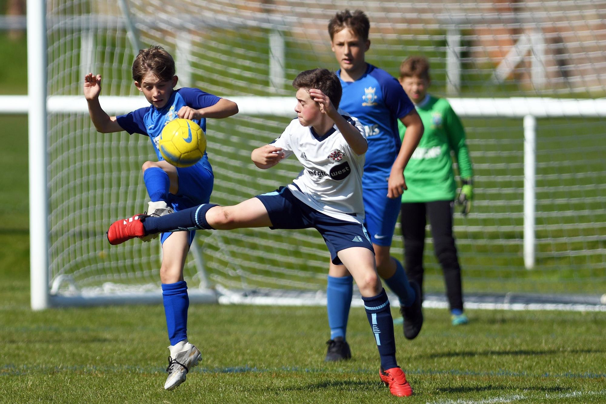 Action from Baffins Milton Rovers under-12s (blue) Portsmouth Youth League A Division encounter with Pickwick Youth Pumas under-12s. Picture Neil Marshall