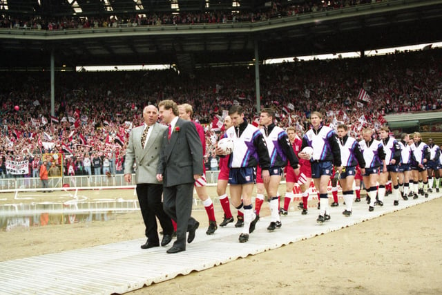 Liverpool's stand in boss Ronnie Moran and Sunderland's Malcolm Crosby lead out their teams for the 1992 FA Cup Final.