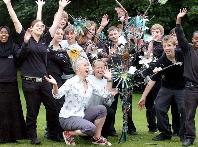 Year 9 pupils at Silverdale School, Sheffield, and artist Lucy Coyne (centre) with their Tree of Life Sculpture, on June 22, 2007