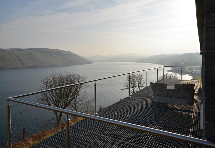 The spacious deck has comfortable furniture to relax on.