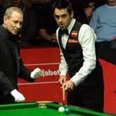 Pictured is Sheffield snooker referee Brendan Moore, left, with Ronnie O'Sullivan.