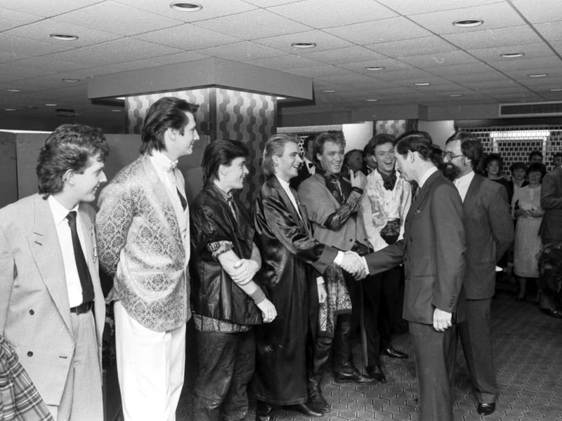 Spandau Ballet's Steve Norman and the Kemp brothers share a joke with Prince Charles after their concert at Ingliston in Edinburgh, November 1984.