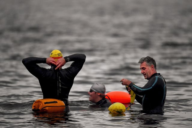 Open water swimming enthusiasts enjoy an early morning swim in Loch Lomond ,Trossachs, Scotland. A new study from the UK Dementia Research Institute found that the blood of regular winter swimmers contains a "cold-shock" protein that wasn't found in that of people who did other cold-weather exercise on dry land.