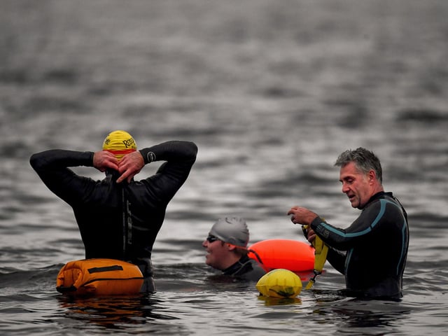 Open water swimming enthusiasts enjoy an early morning swim in Loch Lomond ,Trossachs, Scotland. A new study from the UK Dementia Research Institute found that the blood of regular winter swimmers contains a "cold-shock" protein that wasn't found in that of people who did other cold-weather exercise on dry land.