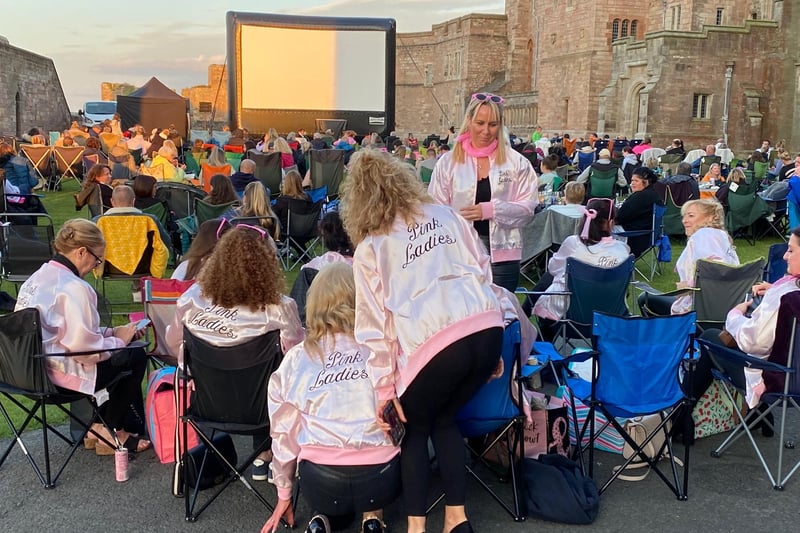 Grease fans settle down for a great night within the grounds of Bamburgh Castle on Saturday, August 14, 2021.