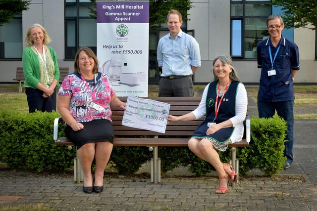 In May, Sutton's King's Mill Hospital's £450,000 gamma scanner appeal reached its target - staff are pictured, socially distanced, receiving the final donation from Jill Smallwood, Voluntary Services chairman, on behalf of Voluntary Services.