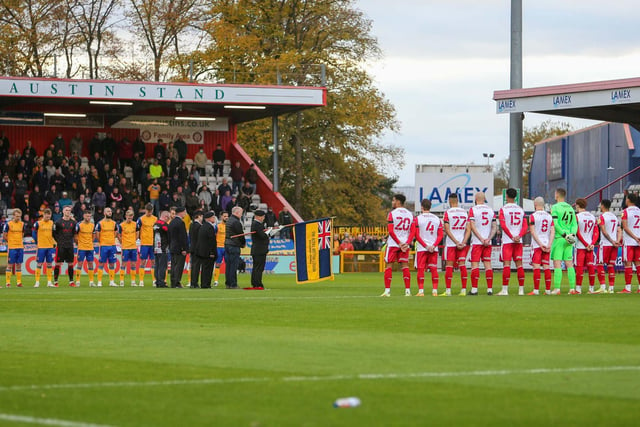 Teams, officials and fans observe a minutes silence prior to the match.