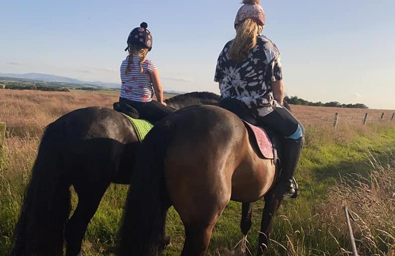 Morgan aged 12 and Imogen aged 7 enjoying a hack in the hills above Berwick.