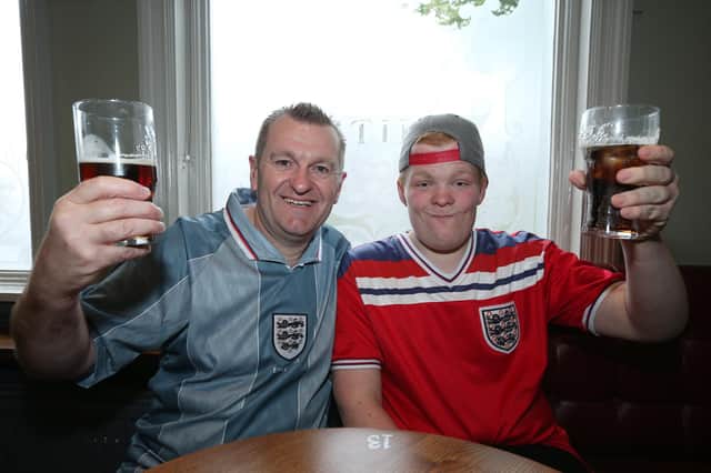 Pete Hayden and his son, Zach. Fans watch England v Czech Reublic in England's third Group D game of Euro 2020, in The Star & Garter pub, Copnor, Portsmouth. Picture: Chris Moorhouse (jpns 220621-16)