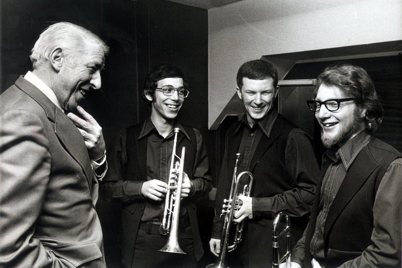 Jazz star Stan Kenton and his orchestra did a one-night stand at the Fiesta, Sheffield, on February 13, 1973. The picture shows Stan, left, chatting with orchestra members Robert Winiker and Frank Minear (trumpets) and Harvey Coonin (trombone) before the concert