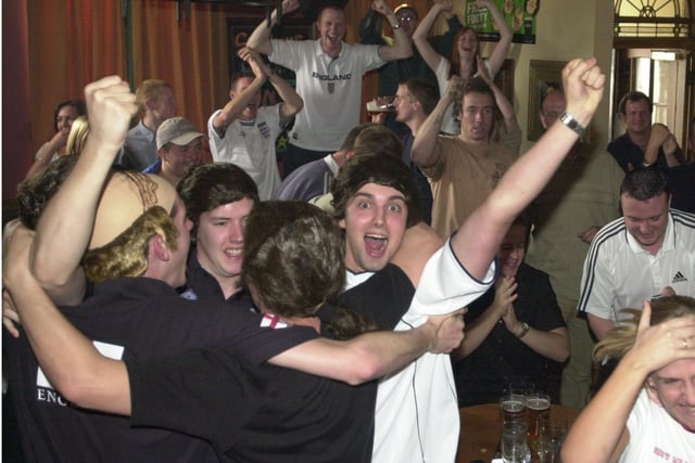 At The Nursery Tavern pub on Ecclesall Road, Sheffield, in June 2002, as fans go wild following the full-time whistle in the England v Argentina match