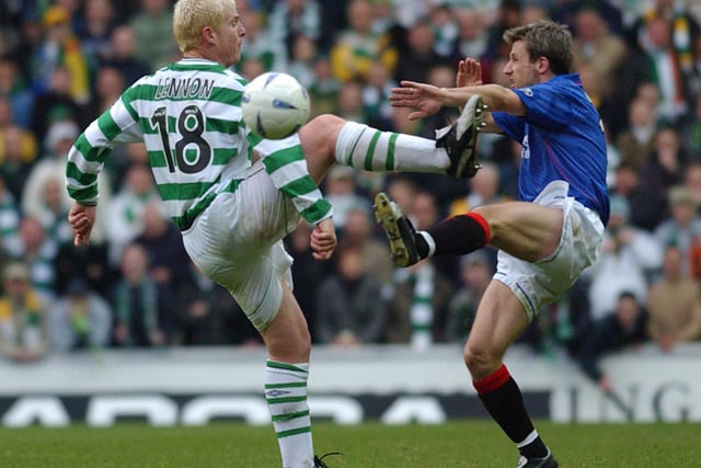 Old Firm Rangers v Celtic football match at Ibrox in December 2002. Celtic's Neil Lennon clashes with Rangers' Neil McCann.