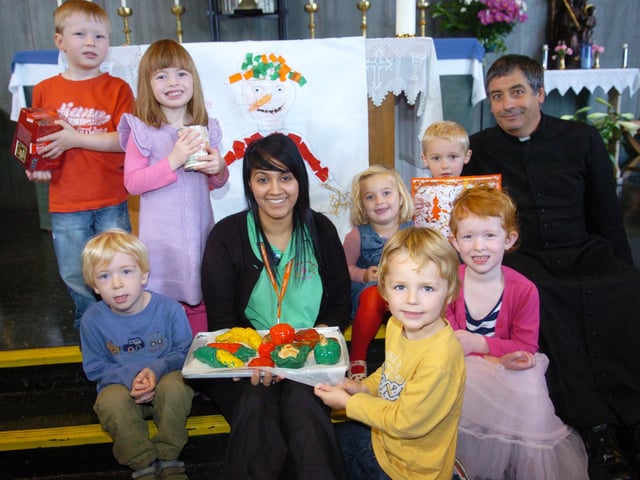 Children at Little Learners Day Nursery enjoyed a Harvest Festival at the Doncaster Deaf Trust's Holy Trinity chapel in 2011. Back L-R are Joshua Fisher, three, Hannah Bond, four, Alice McIlwraith, Alexander Thornley, both three, and Father Jeffrey Stokoe. Front L-R are Jake Bailey, three, nursery nurse Sabrina Aftab, Isaac Dunn, four, and Amber Bailey, three.
