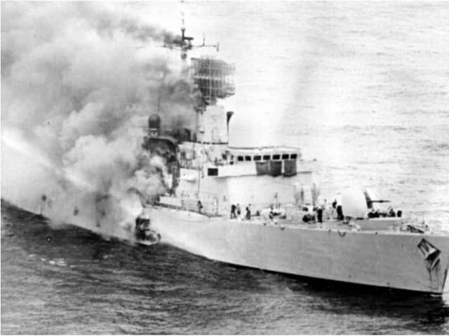 HMS Sheffield ablaze in the South Atlantic in May 1982.