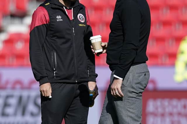 Reda Khadra chats to boss Paul Heckingbottom ahead of a rare start away at Stoke City: Andrew Yates / Sportimage