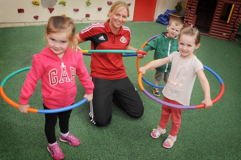 Toddlers at Cleadon Village Kindergarten in 2013. Pictured are Erin Caldor-Crone, Thomas Degnan and Eve Pearson taking part in their sports day with the help of Sunderland Women's footballer, Gemma Wilson.