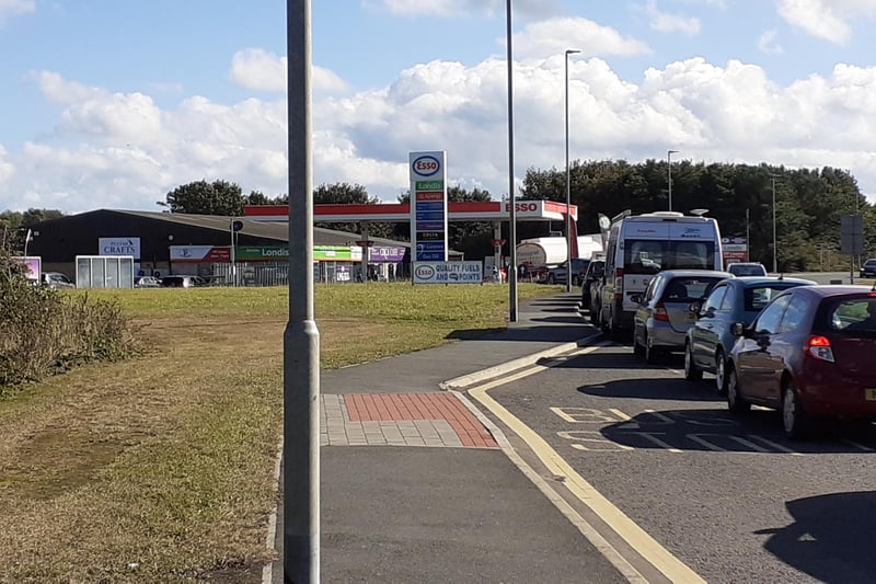 Cars queuing for Esso in Amble.
