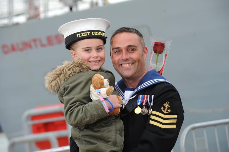15th May 2015. Maddie Gordon and her dad, Ian 'Simmo' Simpson.  Home coming of HMS Dauntless at Portsmouth Dockyard, Portsmouth. Home coming of HMS Dauntless at Portsmouth Dockyard, Portsmouth. 
 Picture: Allan Hutchings (150741-014)