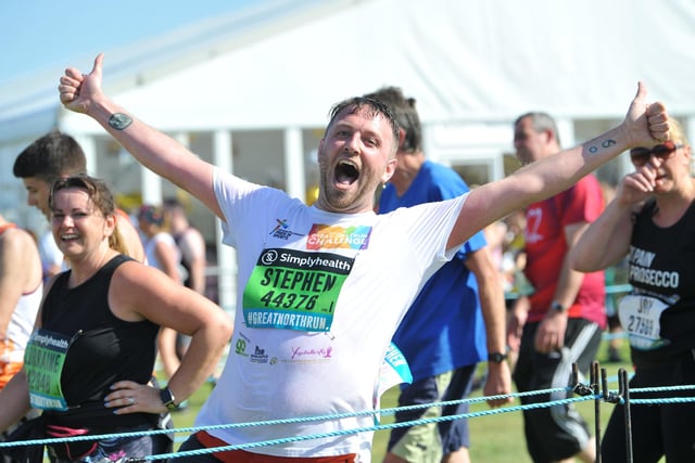 A runner celebrates completing the 2019 Great North Run.