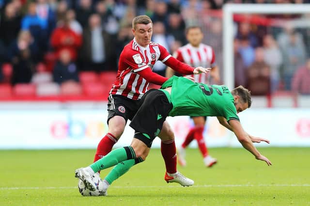 Nick Powell of Stoke City and John Fleck of Sheffield United battle for the ball (Nigel Roddis/Getty Images)
