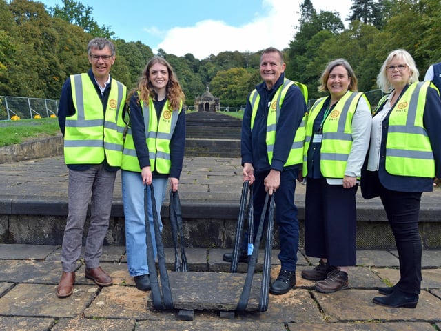 Official breaking ground moment as restoration of the cascade starts. Chatsworth volunteers Amy Hughes and Terry Taylor lift the first stone.