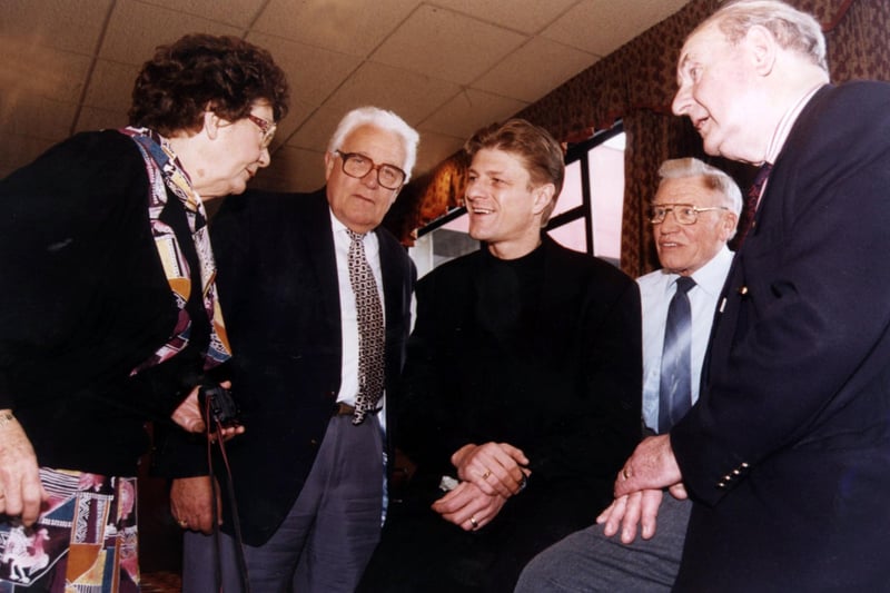 Sean Bean chats with Senior Blades including ex-referee George McCabe before attending a lunch as their guest in the club's Executive Suite on March 12, 1996