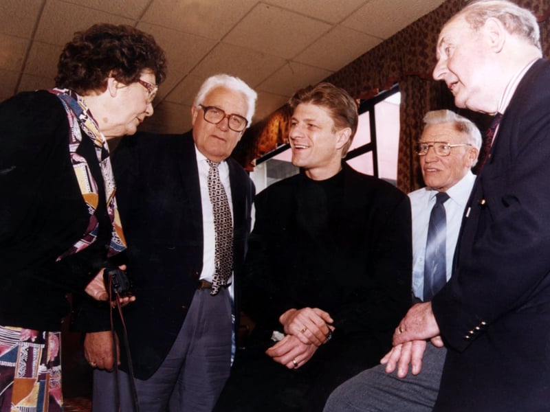 Sean Bean chats with Senior Blades including ex-referee George McCabe before attending a lunch as their guest in the club's Executive Suite on March 12, 1996