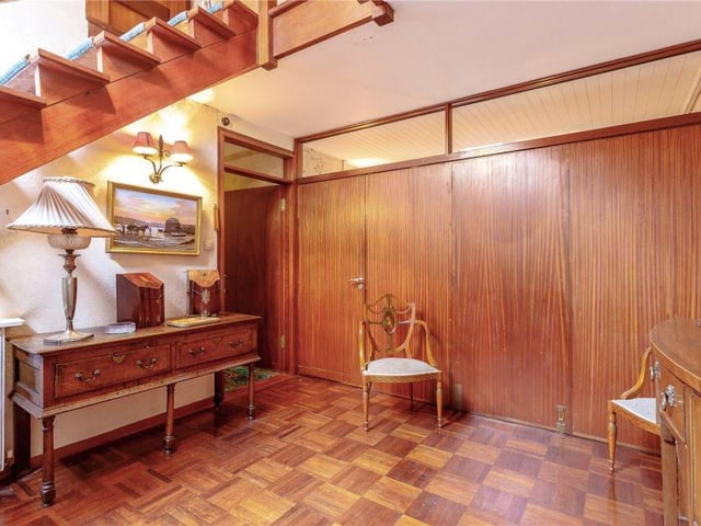 Folding doors from the dining room can open up into the hall, making a generous and versatile entertainment space