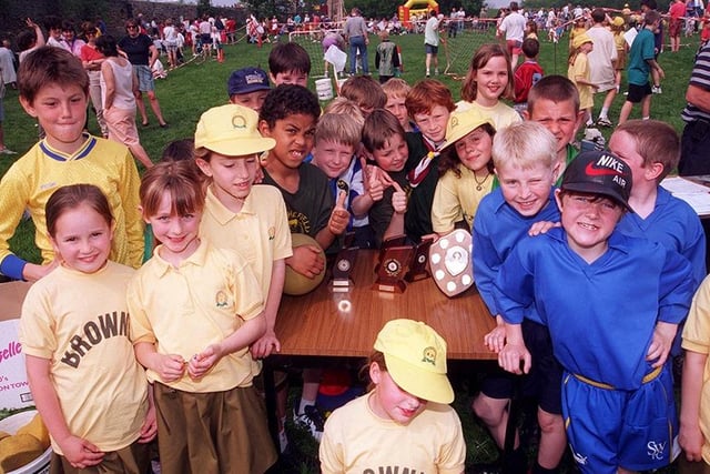 Pictured at the Grenoside Scout and Guide Group HQ on Salt Box Lane, Grenoside, where an It's a Knockout and Gala day was held to raise cash for new headquarters. Seen are  scouts and guides taking part in the event in May 1997