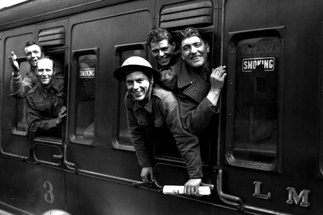 31st May 1940:  Members of the British forces arrive home by train after being evacuated from Dunkirk.  (Photo by H. F. Davis/Topical Press Agency/Getty Images)