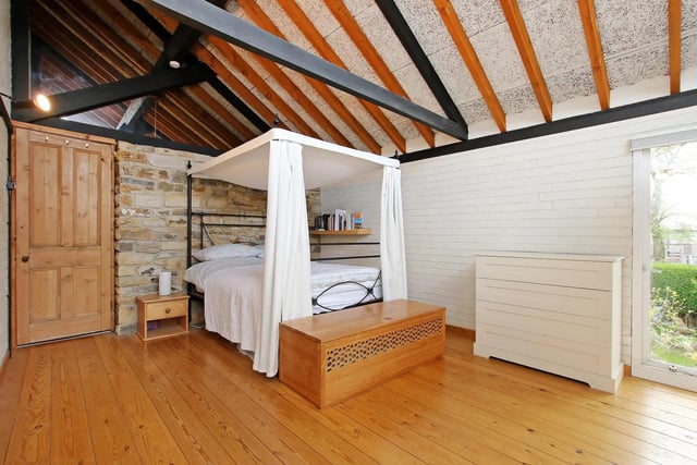 This bedroom is also an amazing looking room when the sun is coming in through that large window. The finish is also very unique with the exposed beams and brickwork.