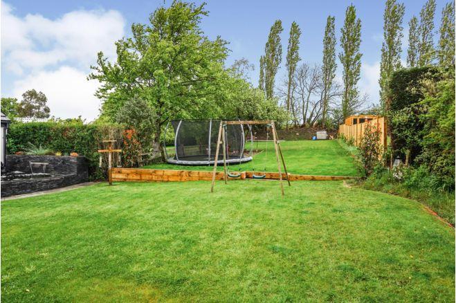 The enclosed garden looks like the perfect place for children to play.