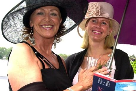 Ladies sheltering from the rain at the Doncaster race course in 2003.