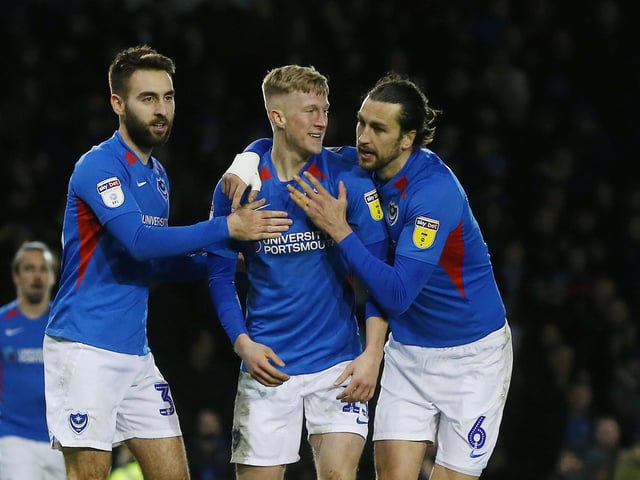 Ben Close and Christian Burgess congratulate Ross McCrorie for setting up John Marquis's goal