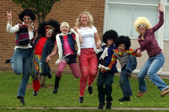 Staff members Gillian Lancaster, left, Vanessa Moon, centre, and Mandy Hall, right, joined pupils from the school for a dress-up day to celebrate the school's 30th anniversary 18 years ago.