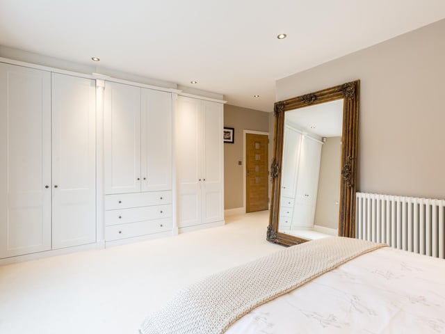 The master bedroom has plenty of built in storage.