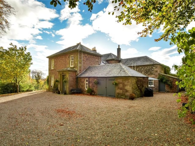East view of house showing garage and main entrance.