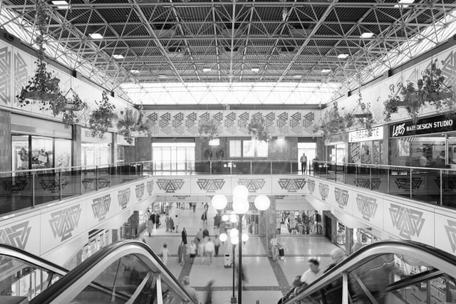 The escalator hall in Cumbernauld Town Centre, which was completed in 1981. The first phase of the centre housed shops, a hotel, ice rink, bowling alley, health centre and penthouse apartments, as well as police, fire and ambulance stations.
