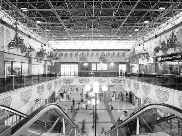 The escalator hall in Cumbernauld Town Centre, which was completed in 1981. The first phase of the centre housed shops, a hotel, ice rink, bowling alley, health centre and penthouse apartments, as well as police, fire and ambulance stations.
