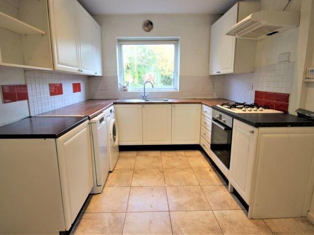 Another view of the kitchen, where a shelved pantry is a highlight. Integrated appliances include an electric fan-assisted oven/grill, a four-ring gas hob and extractor fan over. There is also space and plumbing for a washing machine, while not far away sits an under-stairs cupboard.