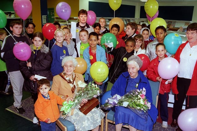Pictured at the new Firth Park Library, Firth Park Road, Sheffield, are, left to right, Gwendoline Wray and Gladys Exley, two of the senior library members who helped perform the official opening. With them are children from Hucklow Primary School who joined in the celebrations in October 1999
