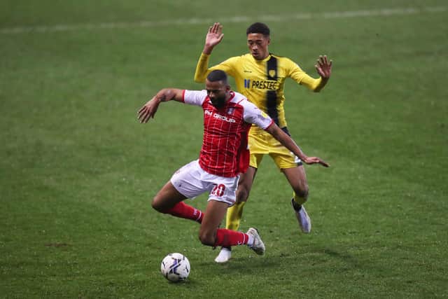 Rotherham United's Michael Ihiekwe (left) and Burton Albion's Daniel Jebbison battle for the ball: Isaac Parkin/PA Wire.