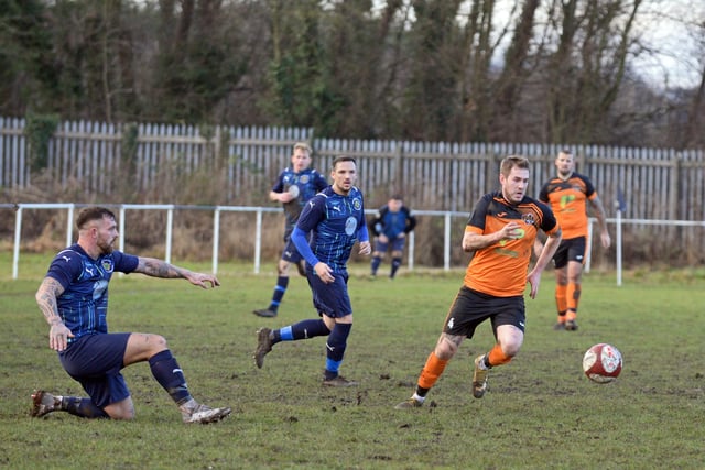 Scawthorpe's Alex Rennie gets away from his man.