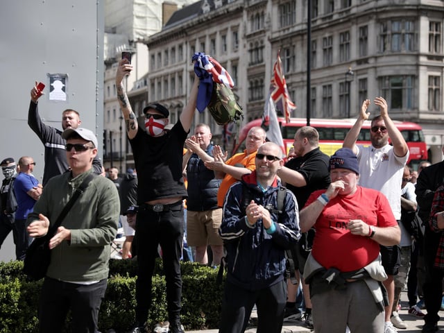 A group gathers around the Winston Churchill statue  (Photo by Dan Kitwood/Getty Images)