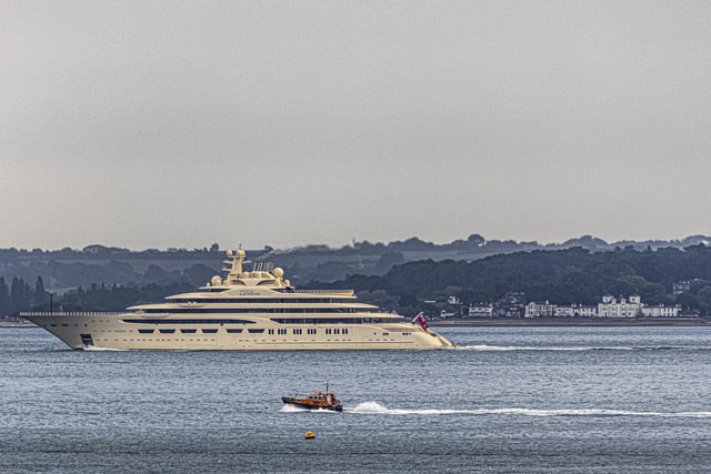 Dilbar is 156m long - and it dwarfs the coastguard's boat in this picture