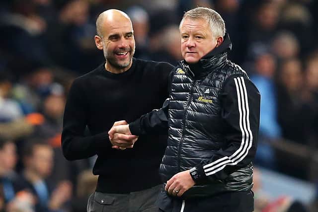 Pep Guardiola shakes hands with Chris Wilder (Photo by Alex Livesey/Getty Images)