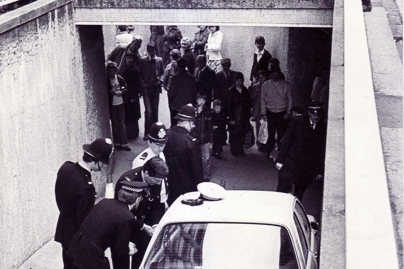 Police deal with a car in the pedestrian subway in Fitzalan Square, Sheffield in April 1979
